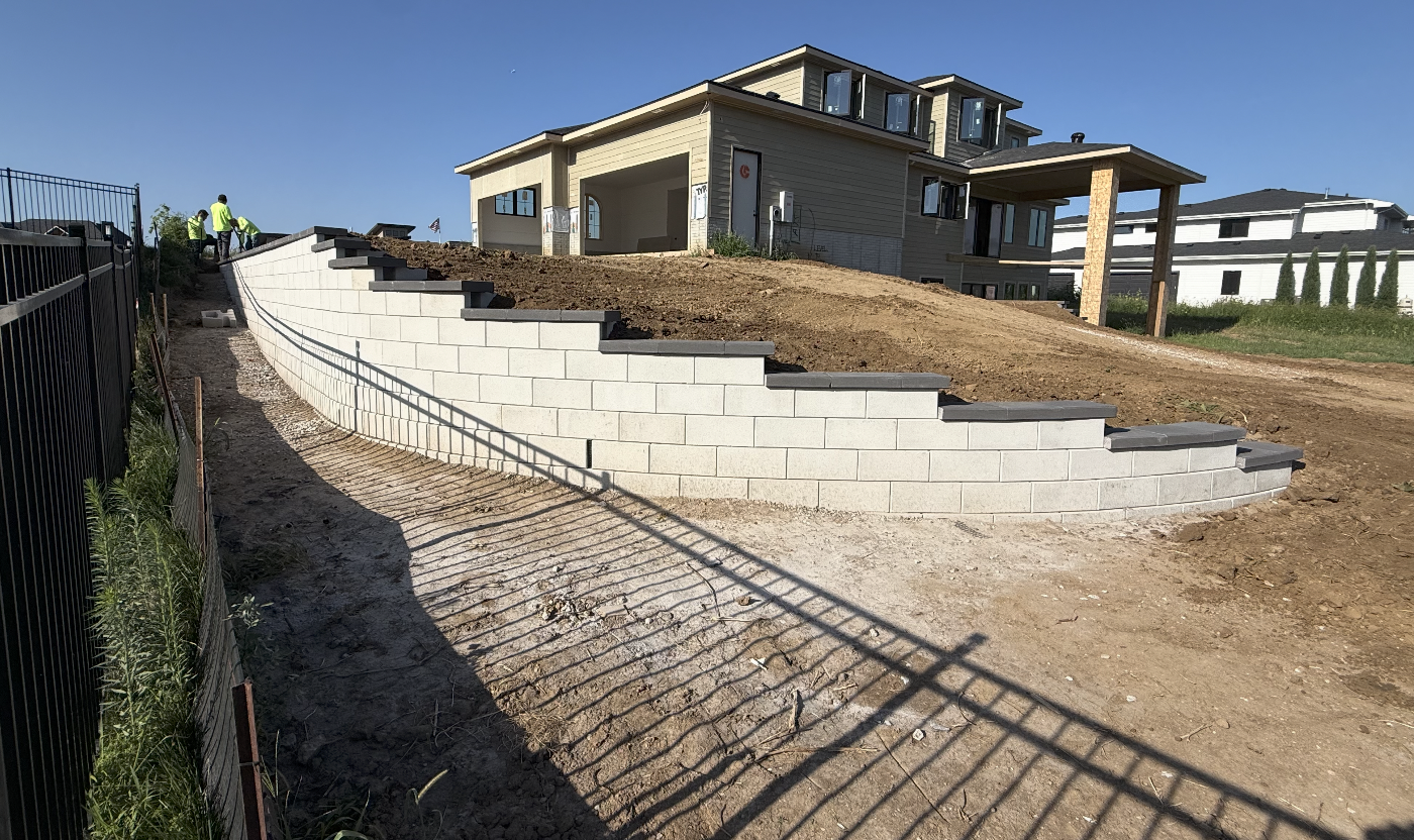 Tiered block retaining wall on a new construction lot